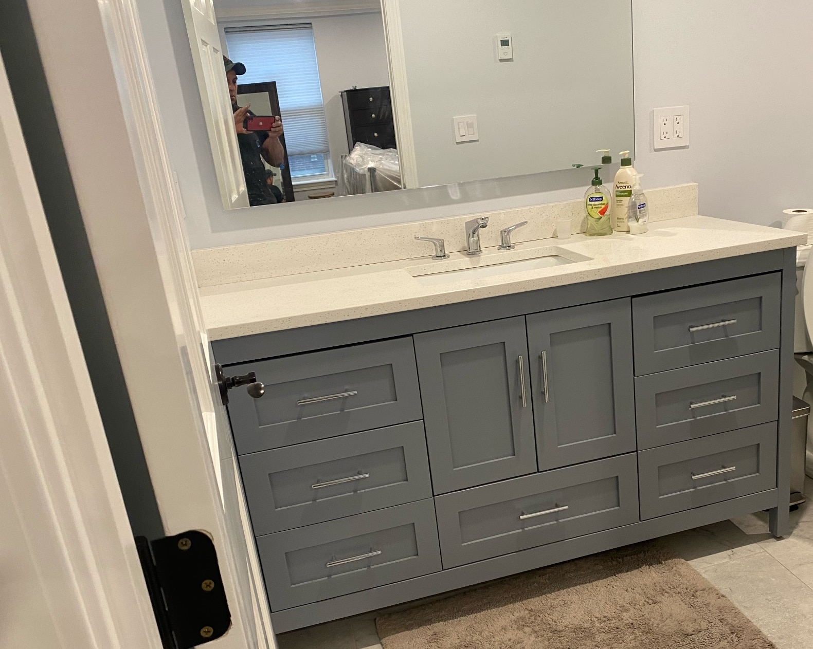 Painted gray bathroom vanity cabinet by Lima Painting in Greater Boston MA
