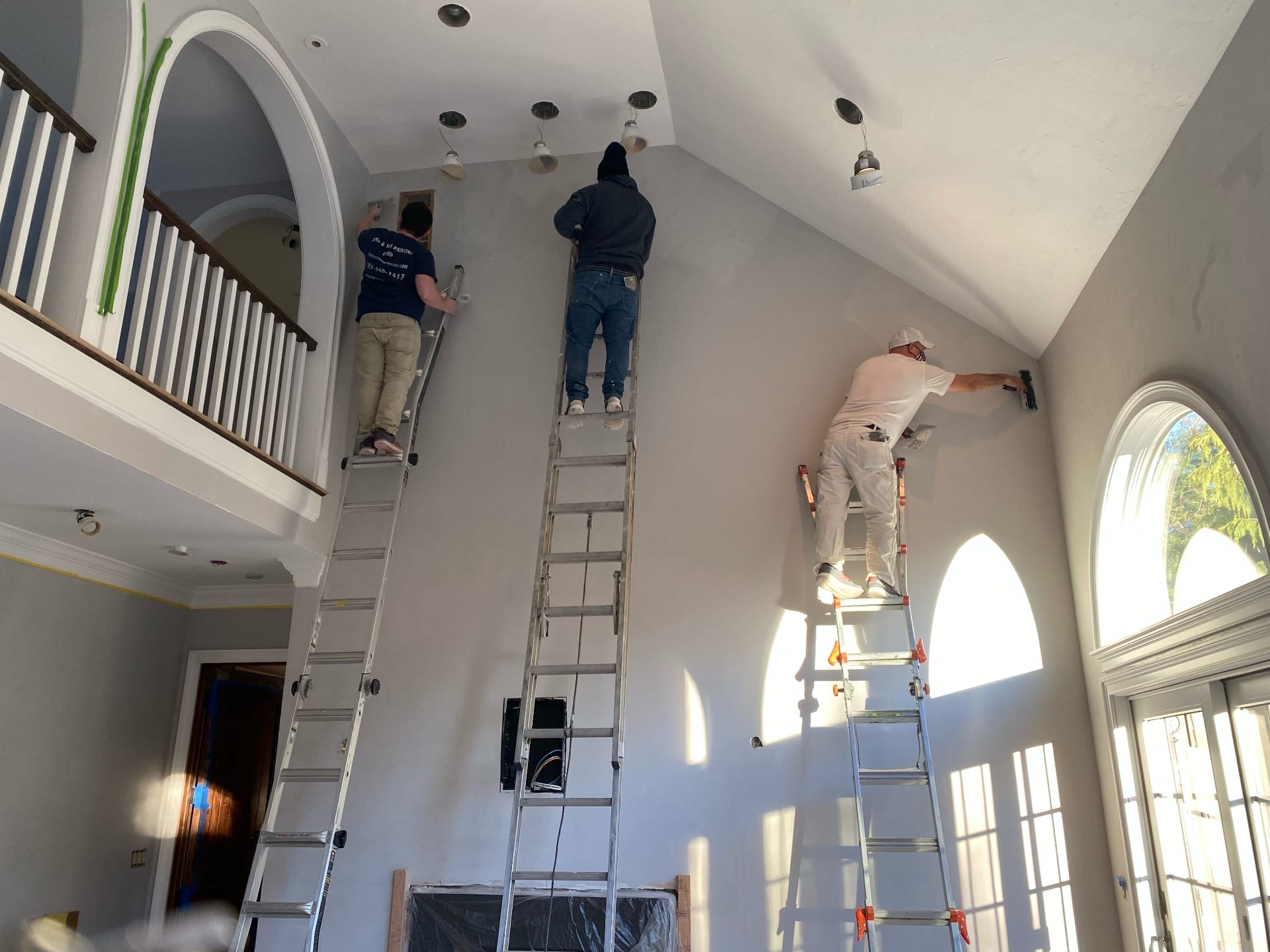 Lima Painting crew painting high vaulted ceiling interior in a luxury Greater Boston home