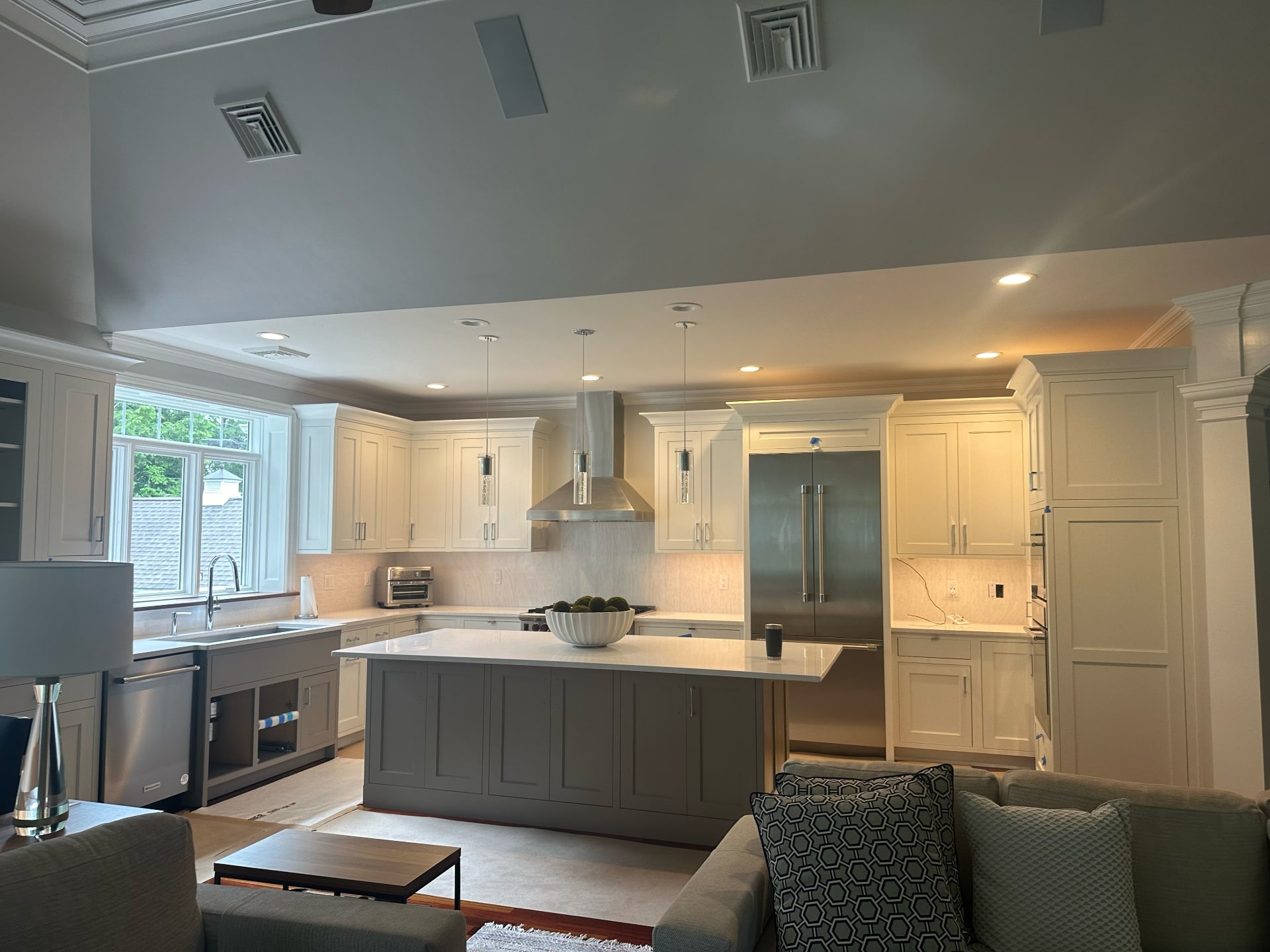 Two-tone kitchen cabinet painting with white uppers and gray island by Lima Painting in Greater Boston MA