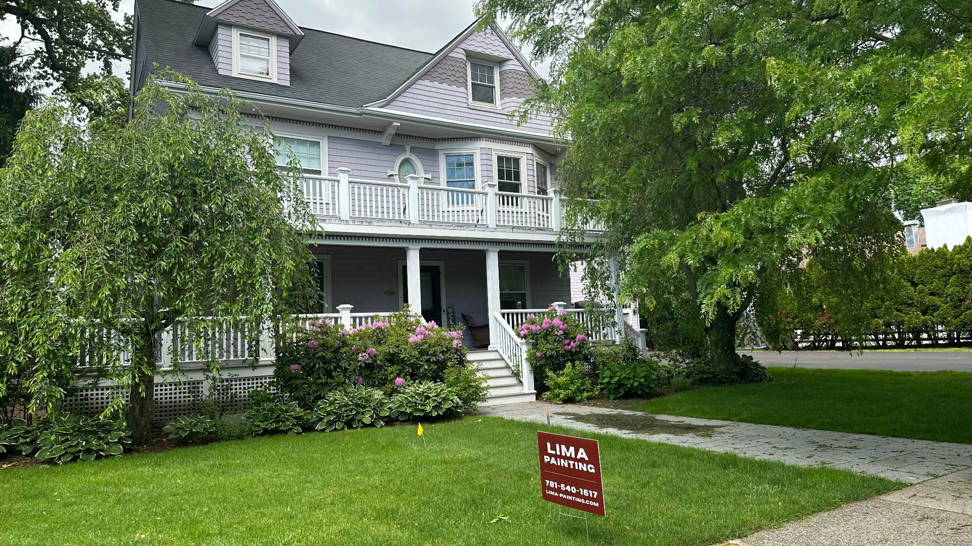 Exterior painting of Victorian home in lavender gray with white trim by Lima Painting in Greater Boston MA